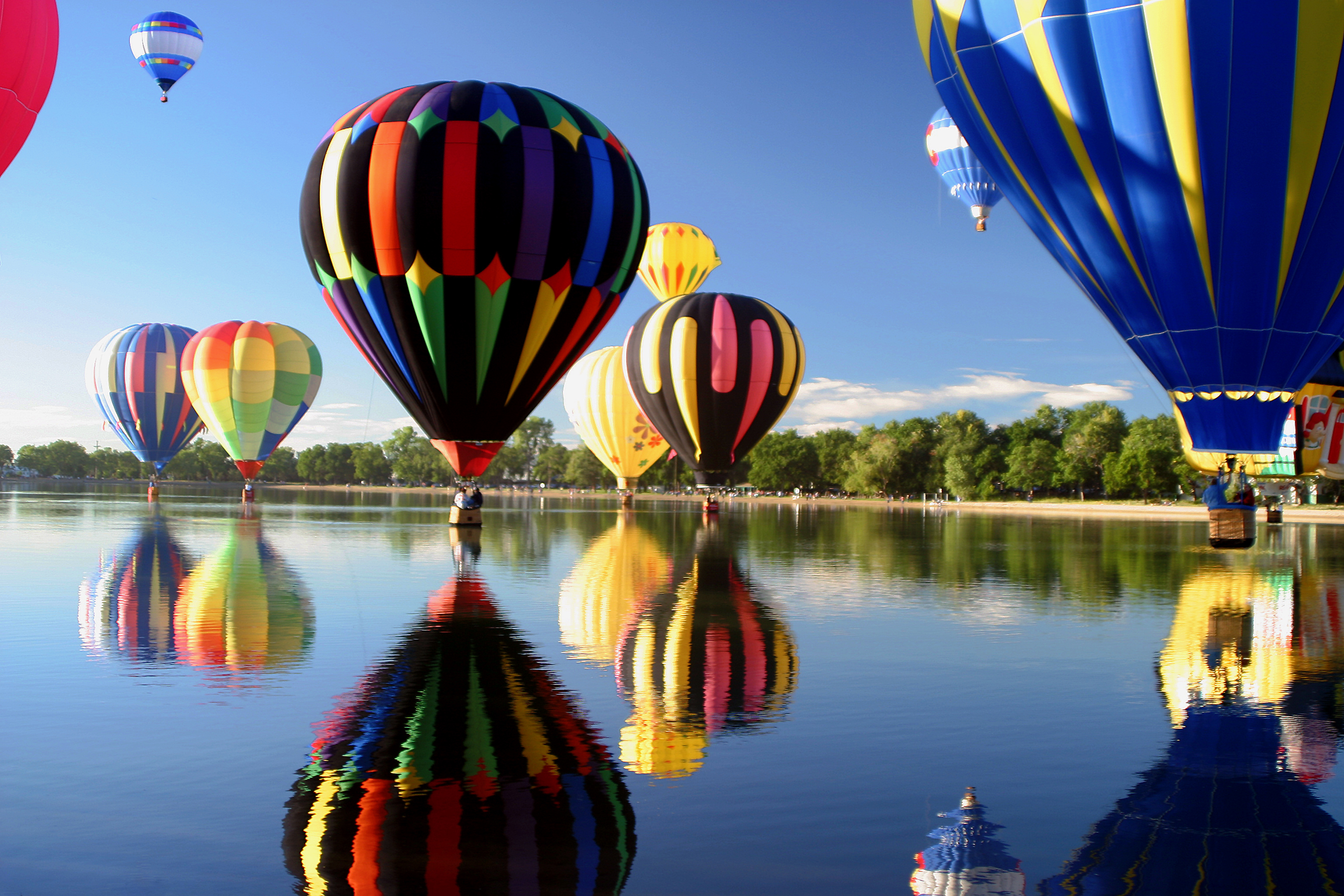 Picture of hot air balloons over water