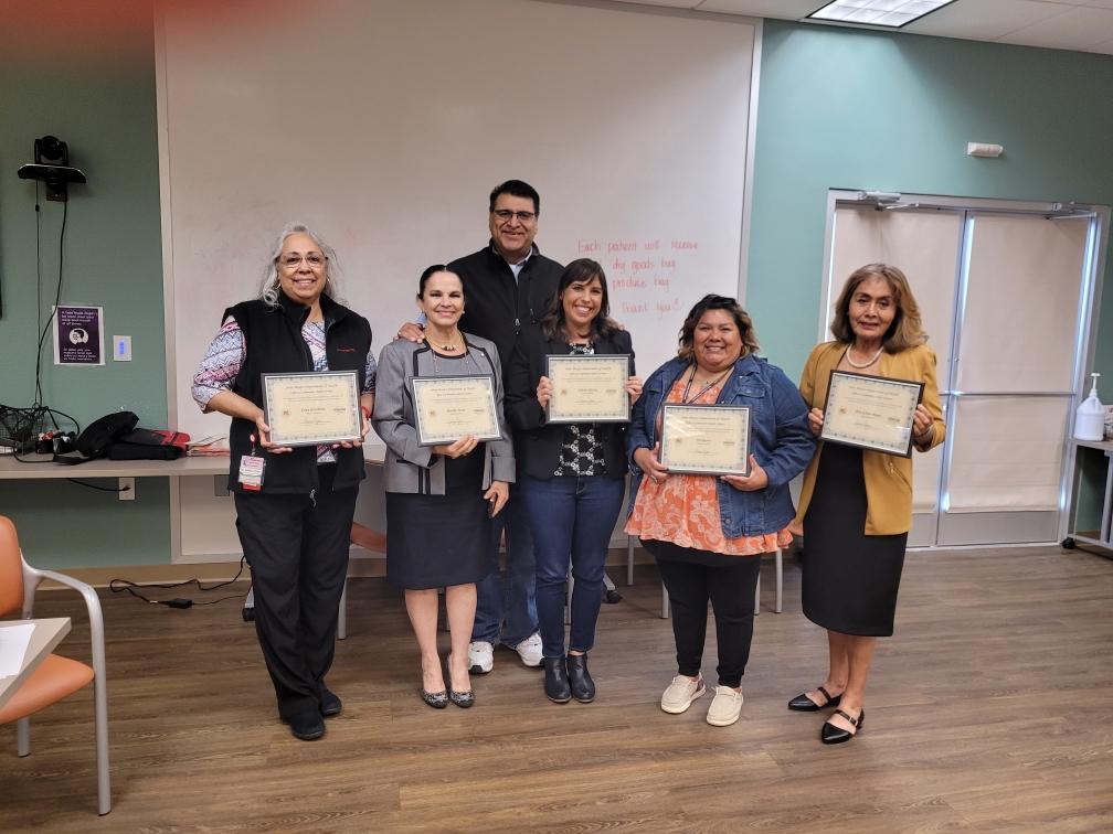 Picture of people holding certificates