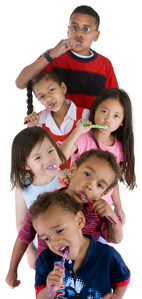 Photo of five children all brushing their teeth.